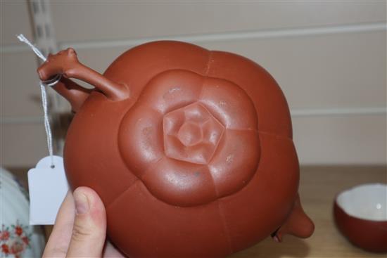 A Yixing pottery teapot and three cups